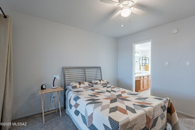 carpeted bedroom featuring ceiling fan and connected bathroom