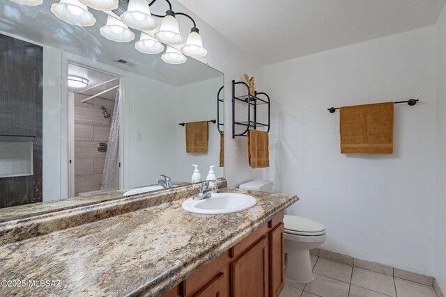 carpeted bedroom with ensuite bathroom and ceiling fan