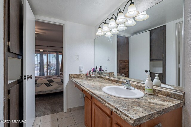 bathroom featuring a shower with shower curtain, tile patterned flooring, vanity, and toilet