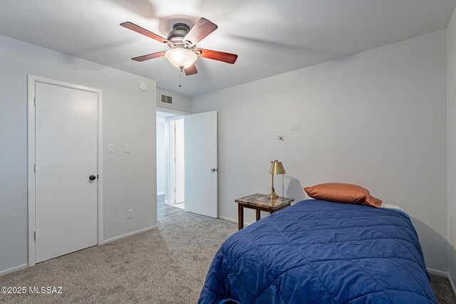 bedroom featuring light colored carpet and ceiling fan