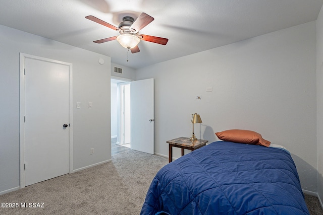 bedroom with ceiling fan and carpet