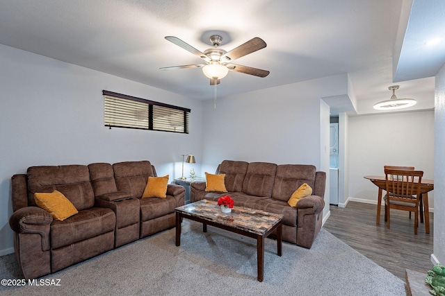 living room with hardwood / wood-style floors and ceiling fan