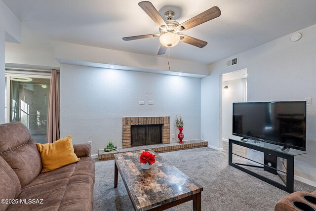 living room featuring ceiling fan and carpet