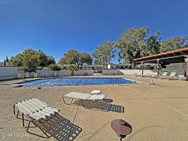 view of swimming pool with a patio