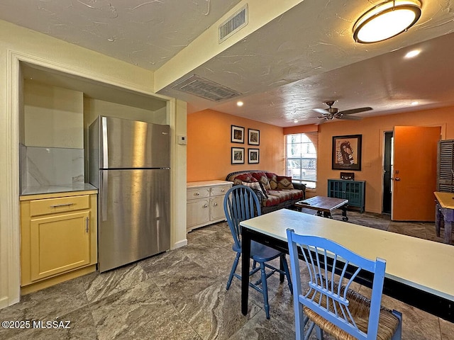 dining room featuring ceiling fan