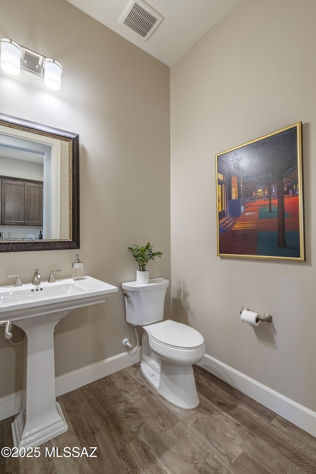 bathroom featuring sink and toilet