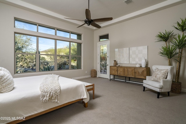 bedroom with access to exterior, ceiling fan, and carpet