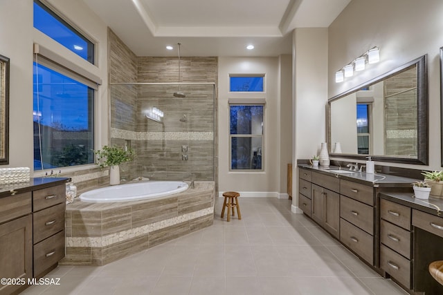 bathroom featuring tile patterned floors, separate shower and tub, and vanity