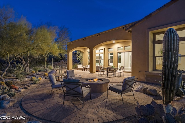 view of patio with an outdoor fire pit