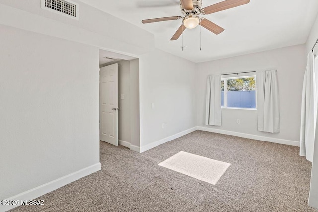 unfurnished room featuring ceiling fan and light colored carpet