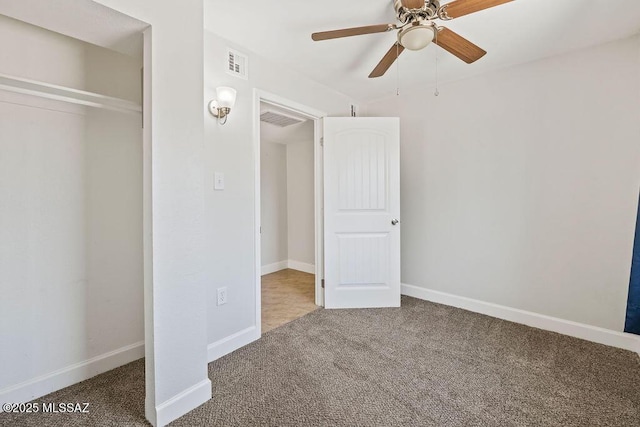 unfurnished bedroom with ceiling fan, a closet, and carpet