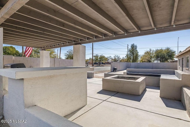 view of patio featuring an outdoor fire pit