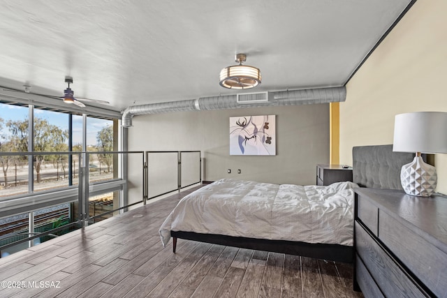 bedroom featuring ceiling fan and hardwood / wood-style floors