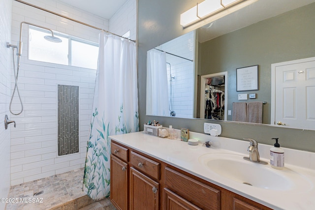 bathroom with vanity and a shower with shower curtain