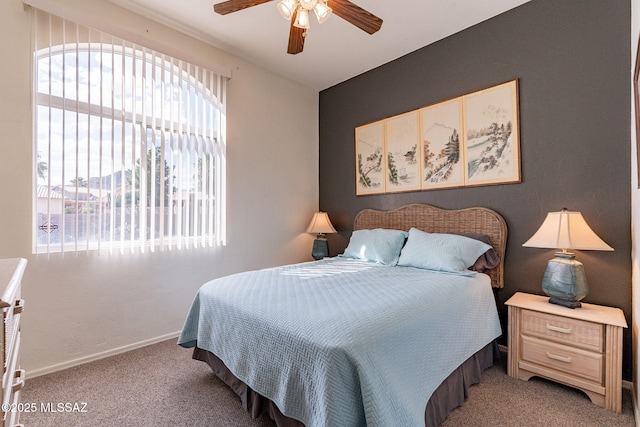 bedroom with light carpet and ceiling fan