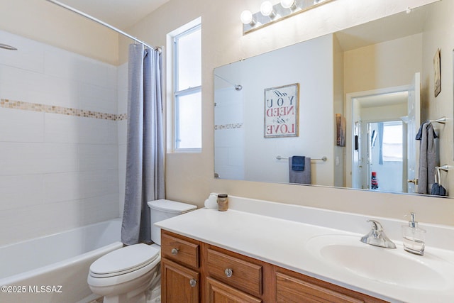 full bathroom featuring vanity, toilet, and shower / bath combo with shower curtain