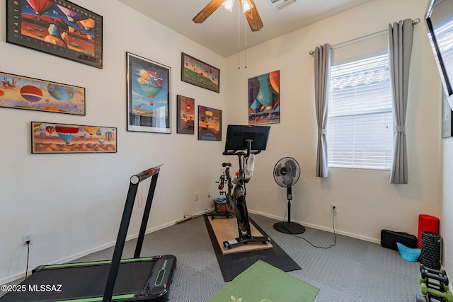 exercise area featuring carpet flooring and ceiling fan