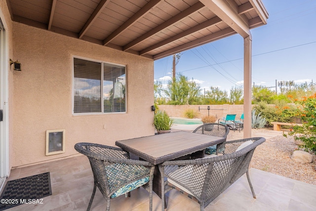 view of patio featuring a fenced in pool