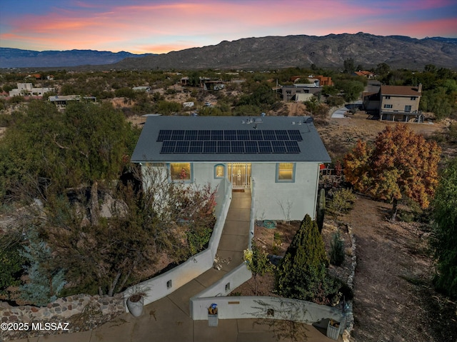 aerial view at dusk with a mountain view