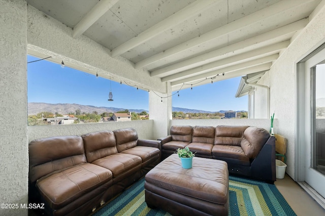 view of patio with a mountain view and an outdoor living space