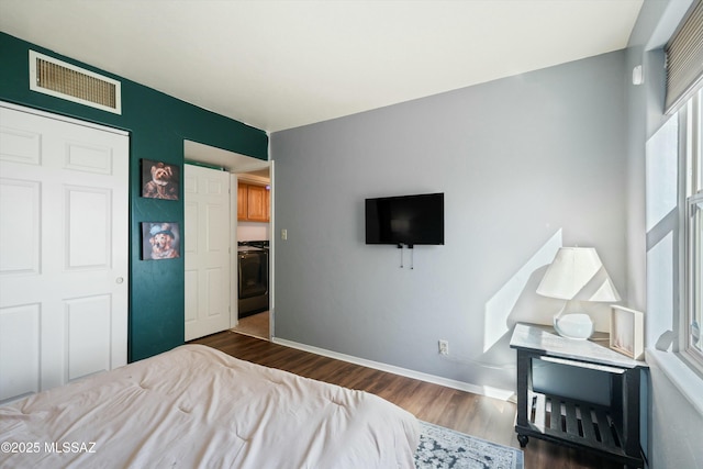 bedroom with dark wood-type flooring