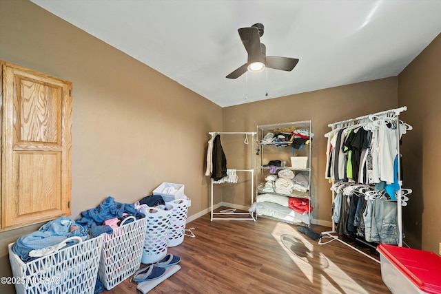 bedroom with ceiling fan and dark wood-type flooring