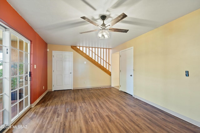 empty room with ceiling fan and hardwood / wood-style flooring