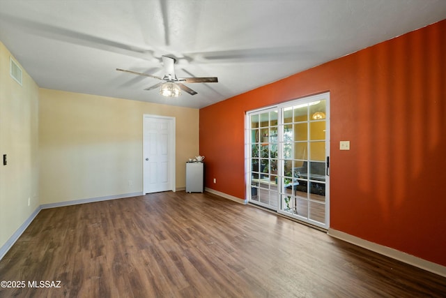 spare room featuring hardwood / wood-style floors and ceiling fan