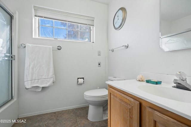 full bathroom featuring toilet, shower / bath combination with glass door, and vanity