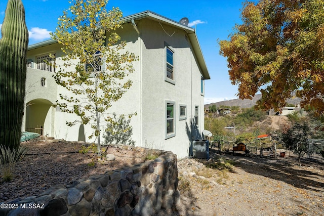 view of home's exterior with cooling unit