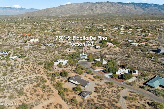 birds eye view of property featuring a mountain view