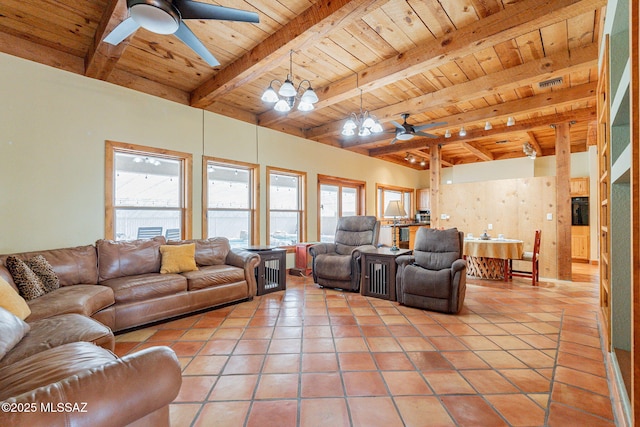 living room with ceiling fan with notable chandelier, wooden ceiling, light tile patterned floors, and beamed ceiling