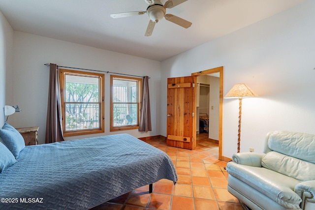 tiled bedroom with ceiling fan