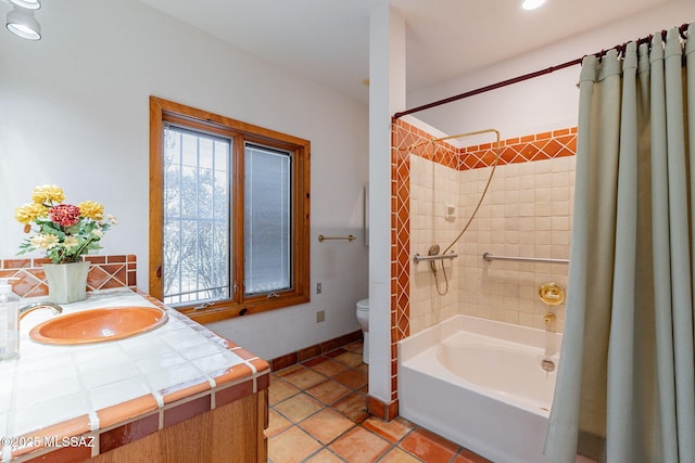 full bathroom featuring vanity, tile patterned flooring, shower / bath combo with shower curtain, and toilet