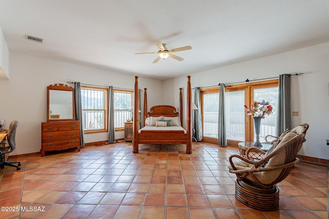 tiled bedroom with ceiling fan and access to outside