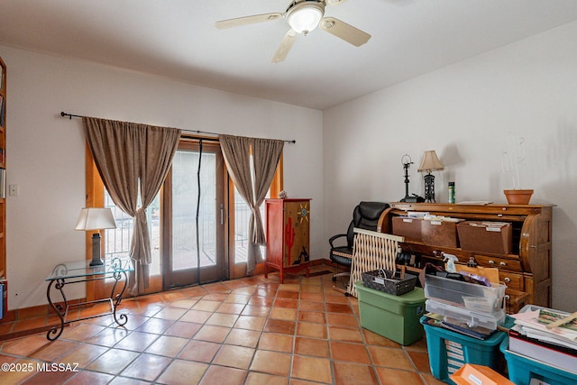 interior space featuring ceiling fan and tile patterned floors