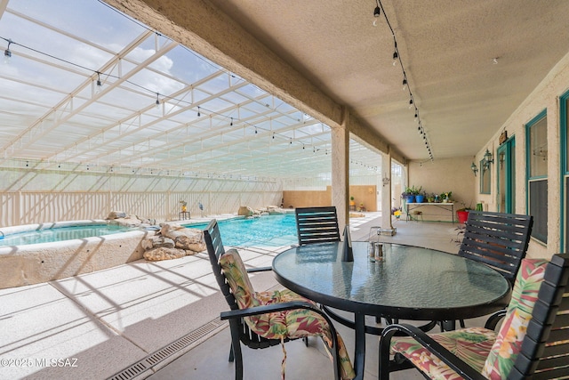 view of patio / terrace featuring an indoor pool