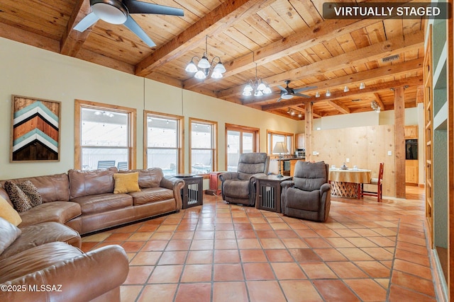 living room featuring beamed ceiling, light tile patterned floors, wood ceiling, and ceiling fan with notable chandelier