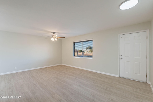 unfurnished room with ceiling fan and light wood-type flooring