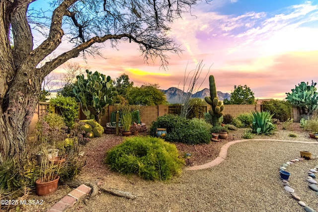 yard at dusk with a mountain view