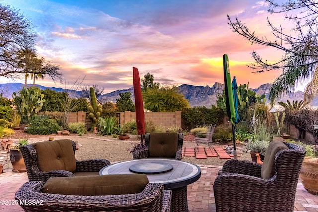 patio terrace at dusk with a mountain view