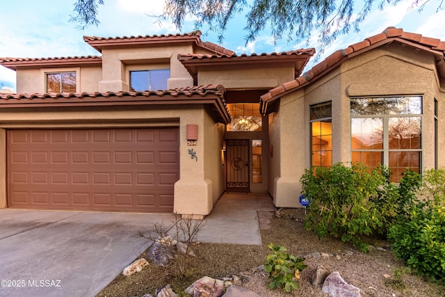 mediterranean / spanish-style home featuring a garage