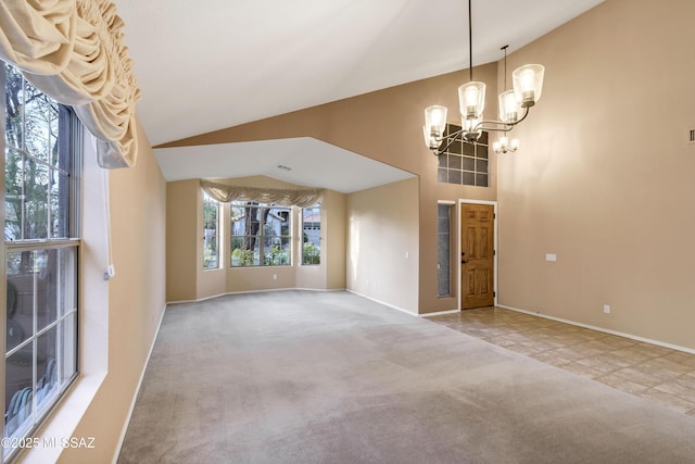 interior space with carpet flooring, a notable chandelier, and high vaulted ceiling