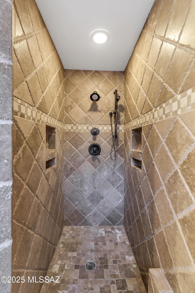 bathroom featuring a tile shower