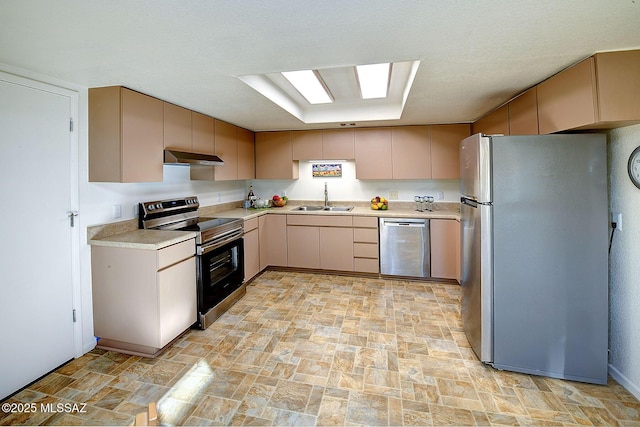 kitchen featuring stainless steel appliances, sink, and light brown cabinetry