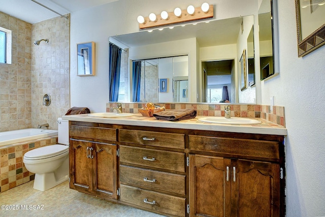 full bathroom featuring shower / bath combination with curtain, vanity, toilet, and tasteful backsplash