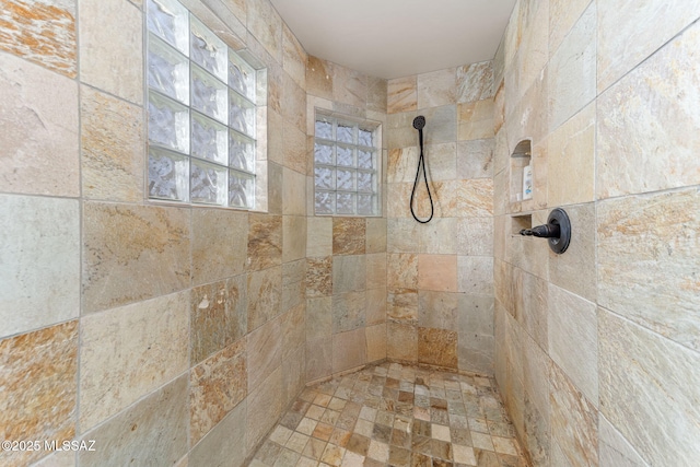 bathroom featuring tiled shower