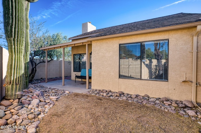 view of property exterior featuring a patio area