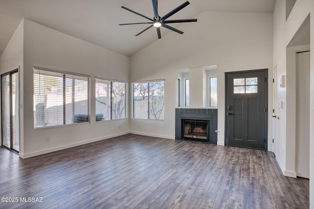 unfurnished living room featuring high vaulted ceiling, ceiling fan, and dark hardwood / wood-style flooring