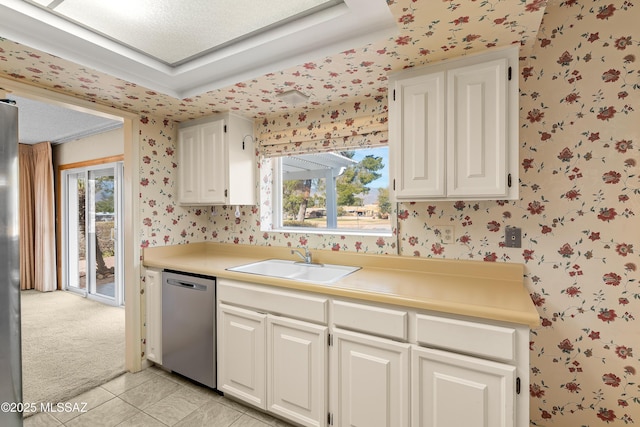 kitchen featuring sink, white cabinetry, and appliances with stainless steel finishes